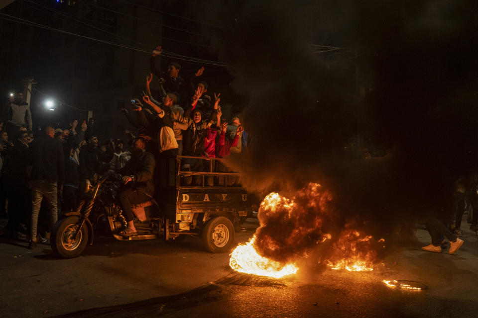 Palestinians celebrate after a shooting attack near a synagogue in Jerusalem, in Gaza City, Friday, Jan. 27, 2023. A Palestinian gunman opened fire outside an east Jerusalem synagogue Friday night, killing seven people, including a 70-year-old woman, and wounding three others before police shot and killed him, officials said. It was the deadliest attack on Israelis in years and raised the likelihood of further bloodshed.(AP Photo/Fatima Shbair)