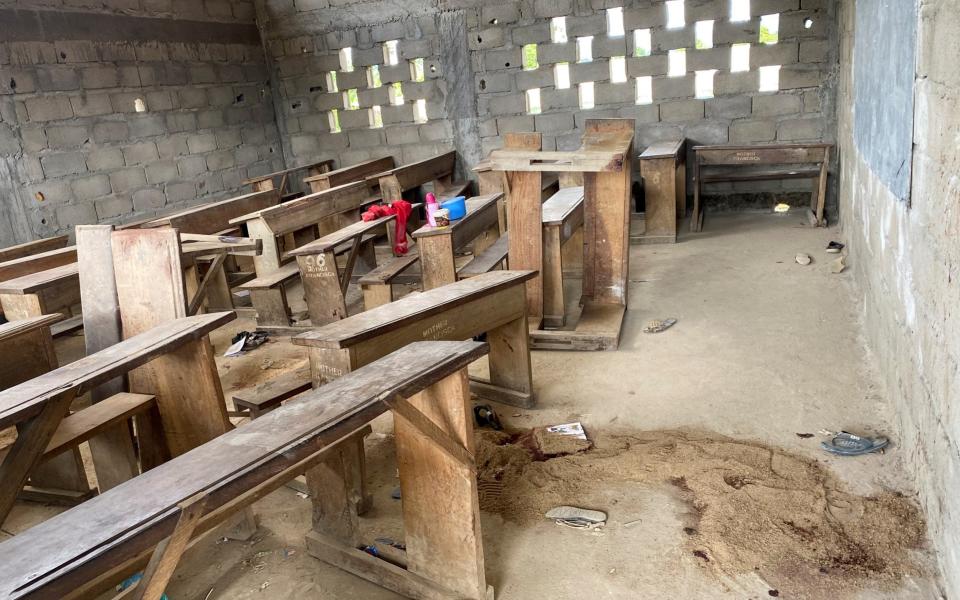 Sand covers a puddle of blood at an empty clasroom following a shooting at a school in Kumba - JOSIANE KOUAGHEU /REUTERS