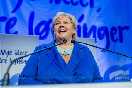 Norway's main opposition leader Erna Solberg of Hoyre speaks to party members while waiting for the results of the general elections in Oslo September 9, 2013. REUTERS/Stian Lysberg Solum/NTB Scanpix