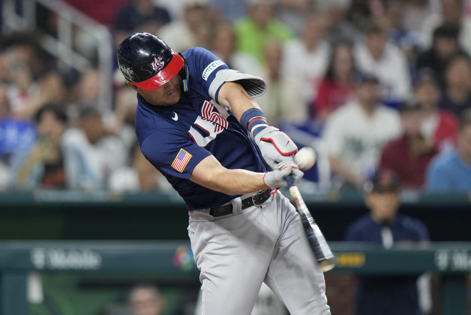 United States' Mike Trout (27) hits a double during first inning of a World Baseball Classic championship game against Japan, Tuesday, March 21, 2023, in Miami. (AP Photo/Wilfredo Lee)