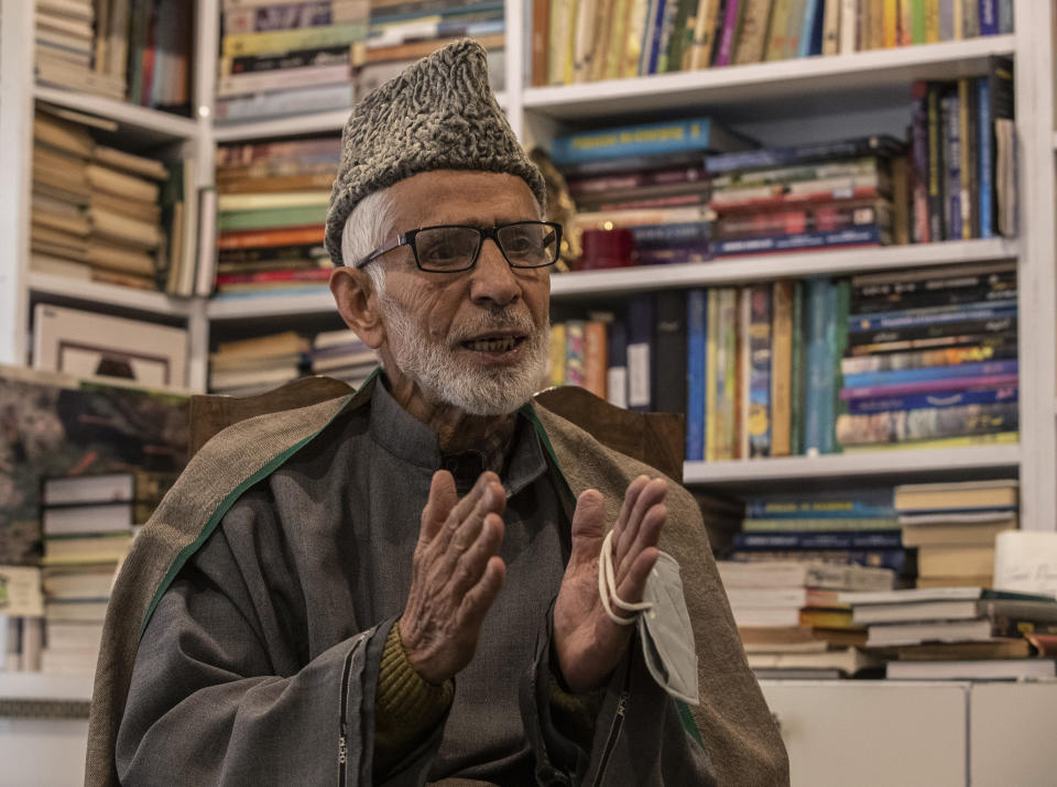 Kashmiri poet Zareef Ahmed Zareef talks to the Associated Press about Jamia Masjid, the grand mosque of Srinagar, at his residence in Srinagar, Indian controlled Kashmir, Nov. 12, 2021. “Jamia Masjid represents the soul of Kashmiri Muslims’ faith and has remained at the center of demands for social and political rights since its foundation some six centuries back,” he said. The mosque has remained out of bounds to worshippers for prayers on Friday – the main day of worship in Islam. Authorities allow the mosque to remain open the other six days. (AP Photo/Mukhtar Khan)