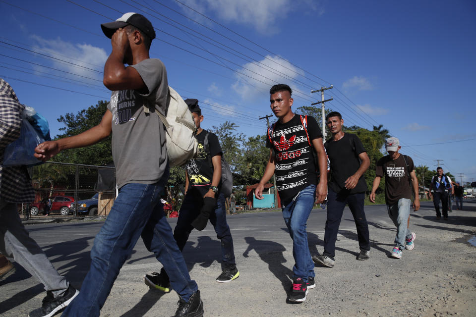 A group of migrants walk on their way to the United States, near El Cinchado, Guatemala, Wednesday, Jan. 15, 2020, on the border with Honduras. Hundreds of mainly Honduran migrants started walking and hitching rides from the city of San Pedro Sula and crossed the Guatemala border in a bid to form the kind of migrant caravan that reached the U.S. border in 2018. (AP Photo/Moises Castillo)