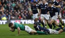 Britain Rugby Union - Scotland v Ireland - Six Nations Championship - BT Murrayfield Stadium, Edinburgh - 4/2/17 Paddy Jackson of Ireland scores try as he is tackled by Josh Strauss of Scotland Reuters / Russell Cheyne Livepic