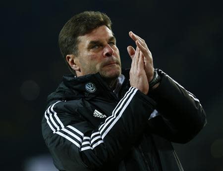 VfL Wolfsburg's coach Dieter Hecking reacts after the German soccer cup (DFB Pokal) semi-final match against Borussia Dortmund in Dortmund April 15, 2014. Dortmund won teh match 2-0. REUTERS/Kai Pfaffenbach