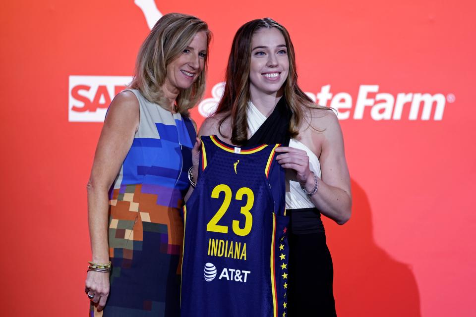 Ohio State's Taylor Mikesell, right, poses for a photo with commissioner Cathy Engelbert after being selected by the Indiana Fever at the WNBA basketball draft, Monday, April 10, 2023, in New York.