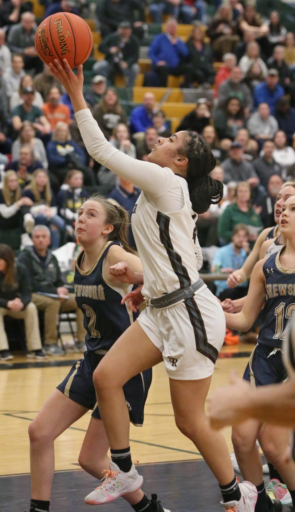 East Rochester's Zarriah Eldridge (4), right, drives to the basket on Frewsburg's Teghan Trocki (2), left, during their Class C Far West Regional game Saturday, March 12, 2022 at Rush-Henrietta High School. 