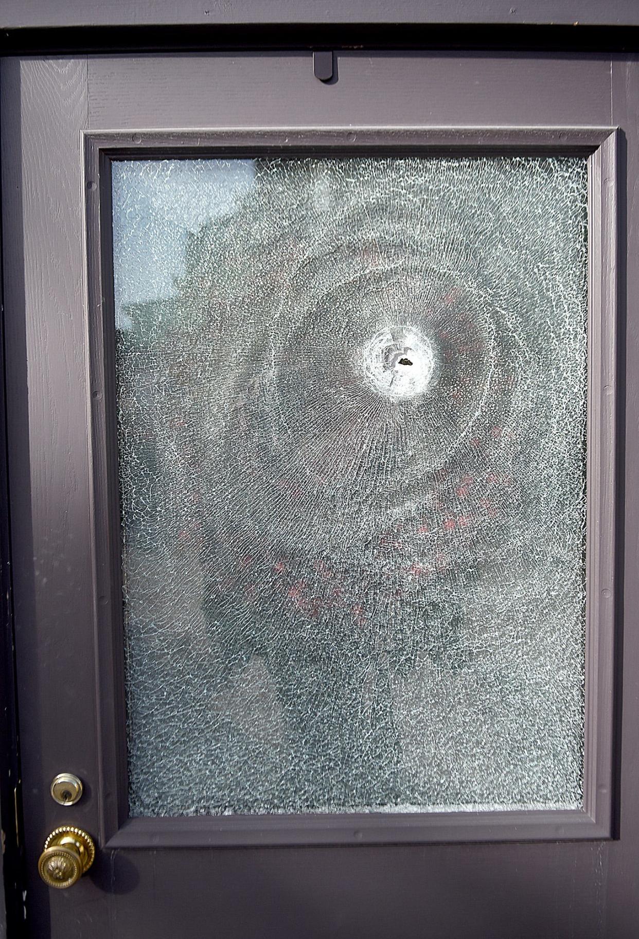 A window in the back door of the Blind Boone Home at 10 N. Fourth St. was struck by gunfire in what police suspect was a result of the gunfight that occurred outside Vibez Lounge at 19 N. Fifth St. early Sunday morning. Five people were wounded by gunfire during the incident. When police arrived, two men with guns ran in opposite directions. Police shot and killed one of the men, while the other man escaped before being arrested later Sunday.