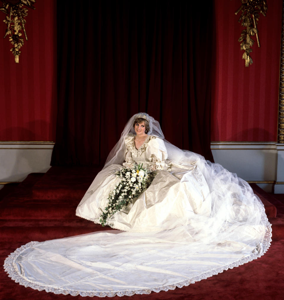 The Princess of Wales seated in her bridal gown at Buckingham Palace after her marriage to Prince Charles at St. Paul's Cathedral.   (Photo by PA Images via Getty Images)