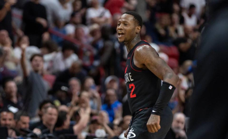 Miami Heat guard <a class="link " href="https://sports.yahoo.com/nba/players/5476/" data-i13n="sec:content-canvas;subsec:anchor_text;elm:context_link" data-ylk="slk:Terry Rozier;sec:content-canvas;subsec:anchor_text;elm:context_link;itc:0">Terry Rozier</a> (2) reacts after scoring a three-point shot against the New York Knicks in the second half of their NBA game at Kaseya Center on April 2, 2024, in Miami. MATIAS J. OCNER/mocner@miamiherald.com