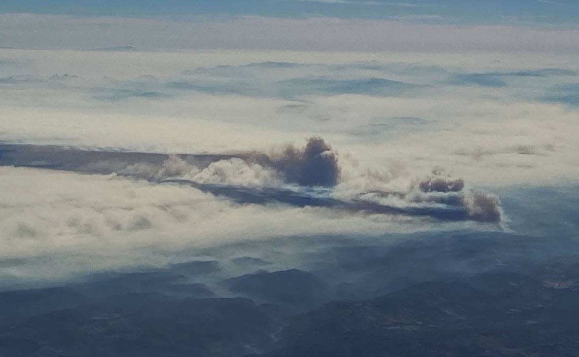 The Oak Fire burning near Yosemite National Park is seen from approximately 36,000 feet above the ground aboard Alaska Air flight 3376 at about 10 am Saturday, July 23, 2022.