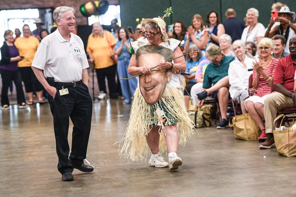 Laura Price, right, of TOPS, wears a dress with Glenn Brill, left, retiring, during the 9th Annual Golden Years Jamboree at the Anderson Sports & Entertainment Complex in Anderson, SC, Wednesday, July 17, 2024.