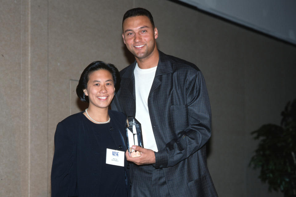 Ng receiving an award from Derek Jeter in 2000<span class="copyright">Nancy Ploeger</span>