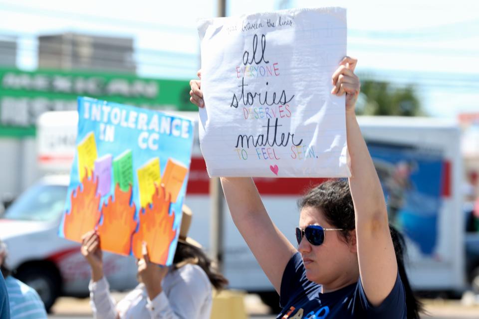 Miranda Galvan, an elementary teacher in Flour Bluff ISD, holds a sign along South Padre Island Drive in Flour Bluff near the office of County Citizens Defending Freedom of Nueces County Saturday, July 9, 2022. Galvan said she shouldn't be scared to be at a protest because someone doesn't agree with her beliefs.