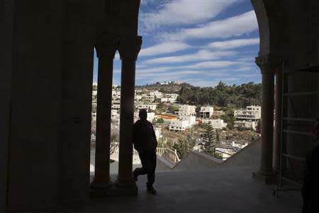 A worker leans on a column in a new mosque in the Israeli-Arab village of Abu Ghosh, near Jerusalem November 22, 2013. REUTERS/Ronen Zvulun