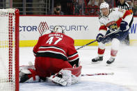 Florida Panthers' Patric Hornqvist (70) has his shot stopped by Carolina Hurricanes goaltender James Reimer (47) during the third period of an NHL hockey game in Raleigh, N.C., Sunday, March 7, 2021. (AP Photo/Karl B DeBlaker)