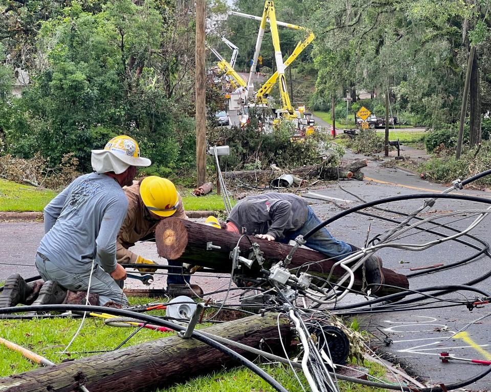 City of Tallahassee Utilities workers addressing the aftermath of Friday's storms.