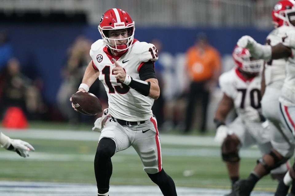 Georgia quarterback Stetson Bennett runs the ball out of the pocket against Alabama.