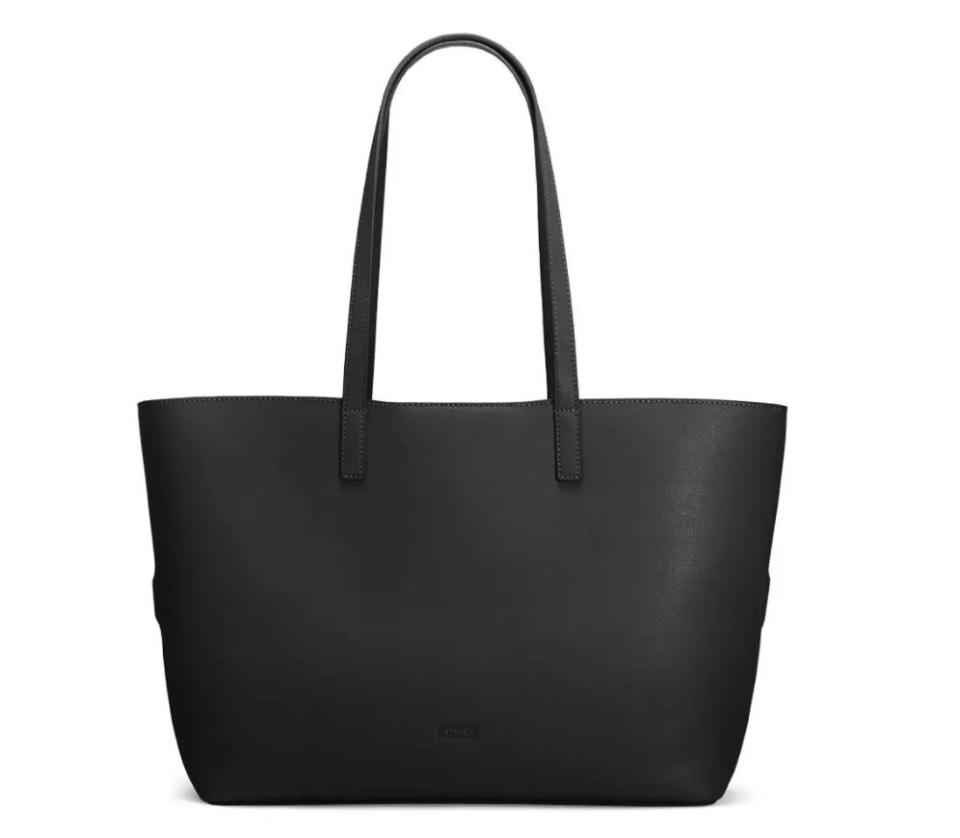 <a href="https://fave.co/2DFB0fk" target="_blank" rel="noopener noreferrer">This leather travel tote</a> has room for a 15-inch laptop and an extra set of clothes. It features a removable strap you can slide over your suitcases like a pass-through pocket. <a href="https://fave.co/2DFB0fk" target="_blank" rel="noopener noreferrer">Normally $245, find it for half off at Away</a> in colors Black, Navy, Buff, Pine, Ruby.