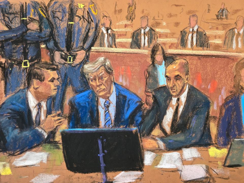 In this courtroom sketch, former President Donald Trump is surrounded by his lawyers, court security and Secret Service sitting behind him during jury selection in his criminal trial in New York on April 16, 2024.