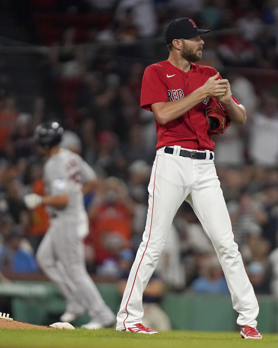 Boston Red Sox's Chris Sale, right, stands near the mound as Houston Astros' Jose Abreu, left, runs the bases toward home after hitting a home run in the second inning of a baseball game, Monday, Aug. 28, 2023, in Boston. (AP Photo/Steven Senne)