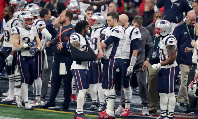 New England Patriots stars Patrick Chung and Tom Brady talk on the sideline during the Super Bowl.