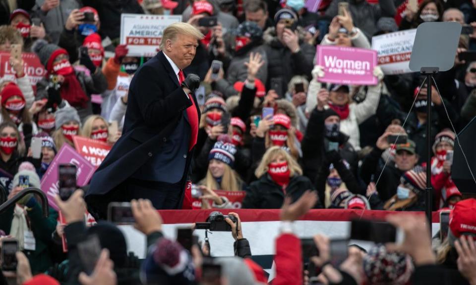 Donald Trump greets supporters in Waterford Township, Michigan, on 30 October.