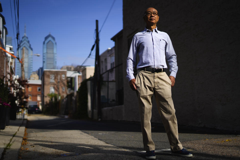 Jerry Cheng poses for a photograph in Philadelphia, Friday, Nov. 4, 2022. As a naturalized U.S. citizen, Cheng doesn’t mind the rough-and-tumble of American politics. The retired mechanical engineer cherishes his ability to participate in democracy...and especially his freedom to criticize politicians. (AP Photo/Matt Rourke)