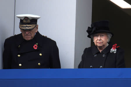 Britain's Queen Elizabeth II and Prince Philip, Duke of Edinburgh stand in silence at the Remembrance Sunday Cenotaph service in London, Britain, November 12, 2017. REUTERS/Toby Melville