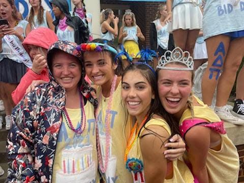 UT FUTURE student Zoe Messer, left, poses for a photo with members of Alpha Delta Pi sorority on Bid Day in Knoxville, Tennessee.