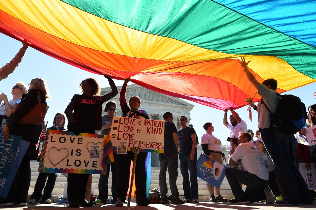 WASHINGTON, DC - APRIL 28: Supporters of gay marriage stand ben