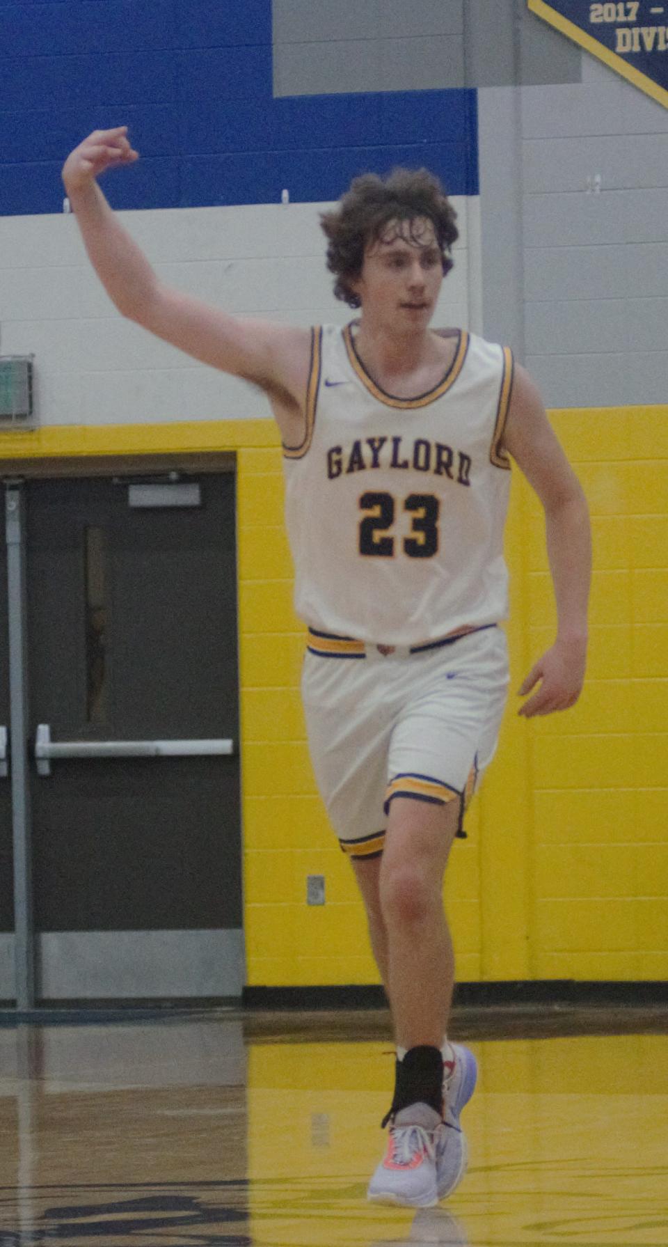 Luke Enders celebrates a 3-pointer during a basketball matchup between Gaylord and Charlevoix on Tuesday, December 6 in Gaylord, Mich.