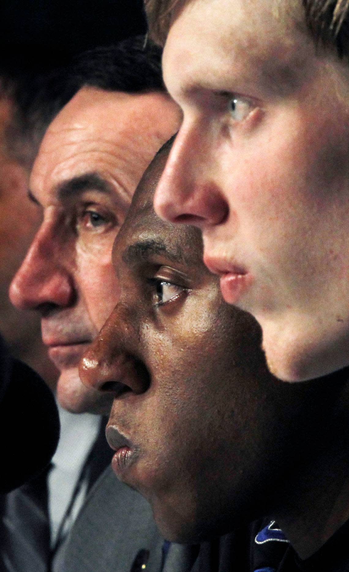 Mike Krzyzewski, left, Nolan Smith, middle, and Kyle Singer ponder their loss in the NCAA Tournament in 2011.