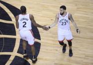 May 21, 2019; Toronto, Ontario, CAN; Toronto Raptors forward Kawhi Leonard (2) celebrates with Raptors guard Fred VanVleet (23) during the fourth quarter in game four of the Eastern conference finals of the 2019 NBA Playoffs at Scotiabank Arena. Mandatory Credit: Nick Turchiaro-USA TODAY Sports