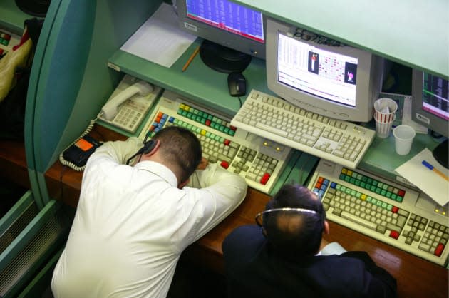 Electronic trade at the Istanbul Stock Exchange, ISE: broker sleeping at his desk.