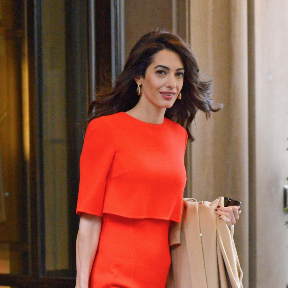 The world’s most famous human rights attorney, Amal Clooney, stepped out in a sleek frock that recalled Meghan Markle’s recent look.