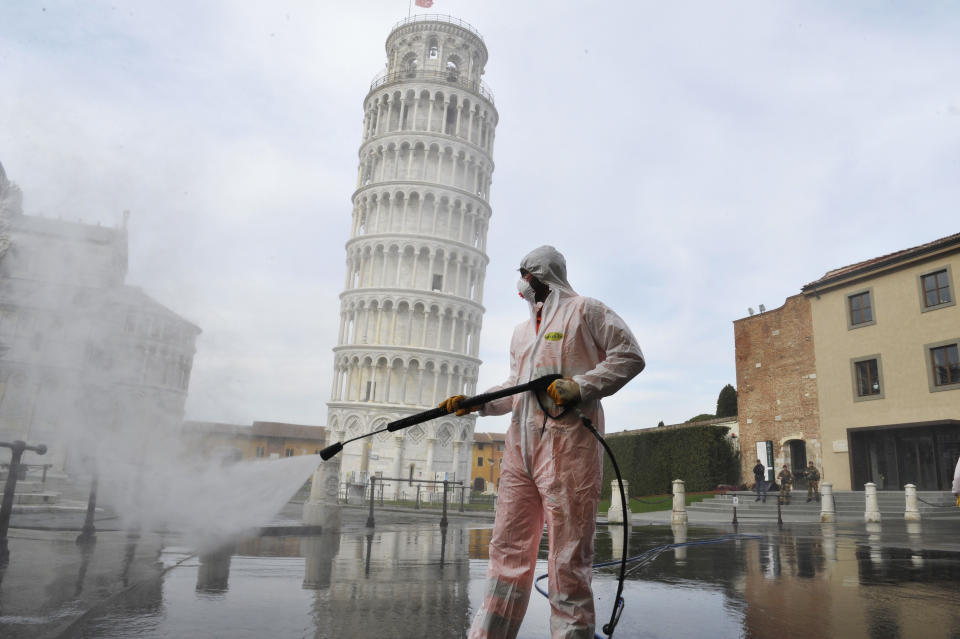In the nearly deserted town of Pisa, Italy, a worker carries out sanitation operations during the coronavirus pandemic. (Photo by Laura Lezza/Getty Images)