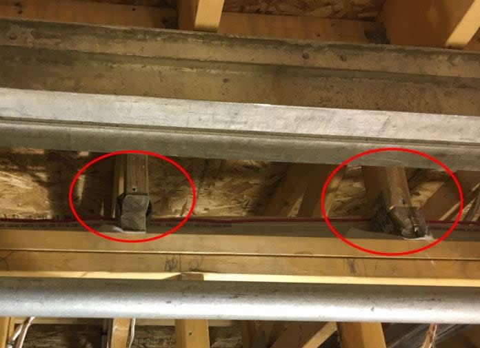 Crushing and twisting of truss bottoms were noted by inspectors who were tasked with investigating the damage caused by a fire on the property. 