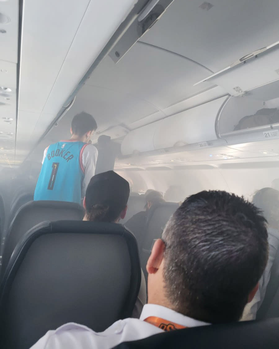 Smoke filled the cabin after the fire broke out in an overhead cabin. (@nottajshow / Twitter)