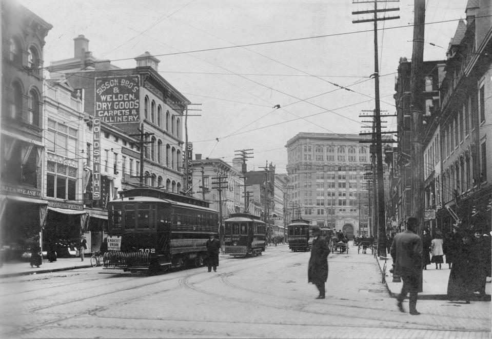 Traffic on Court Street in Binghamton, home to several shoe repair shops, about 1930.
