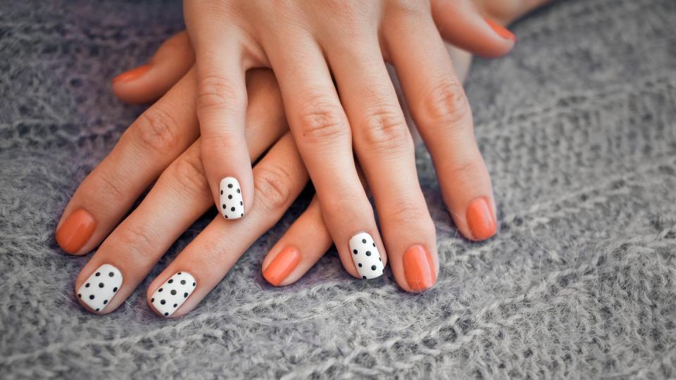 fall nail ideas orange polka dot design