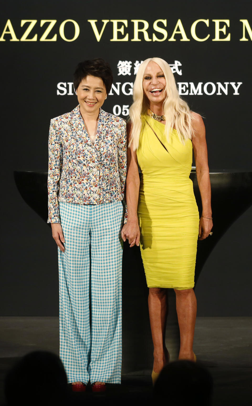 Angela Leong, Managing Director of SJM, left, poses with Donatella Versace during the Palazzo Versace Macau signing ceremony in Macau Thursday, Sept. 5, 2013. Italian fashion house Versace and Macau casino company SJM said the Versace-themed hotel they're planning for the Asian gambling city will be tweaked to appeal to the local Chinese market and open in 2017. Versace and SJM Holdings signed a deal last month to build the hotel at SJM's Cotai resort in Macau. (AP Photo/Kin Cheung)