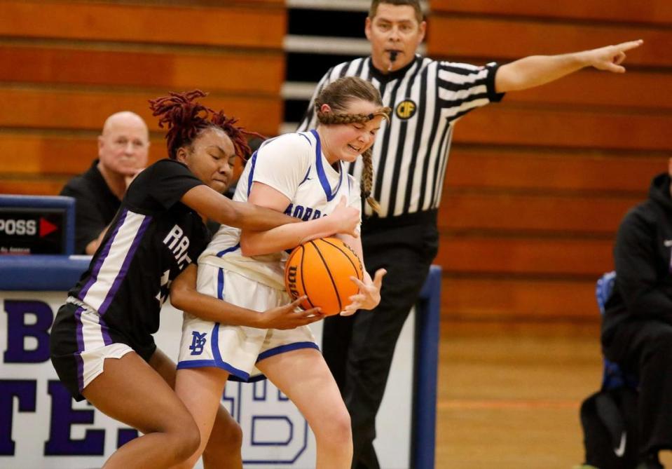 Morro Bay High School girls basketball team beats Rancho Cucamunga 49 - 29 in the CIF state playoffs at Morro Bay High School, Tuesday, Feb. 27, 2024. Rancho Cucamunga’s Naida Hall (11) tries to steal the ball from Violet Pace (24).