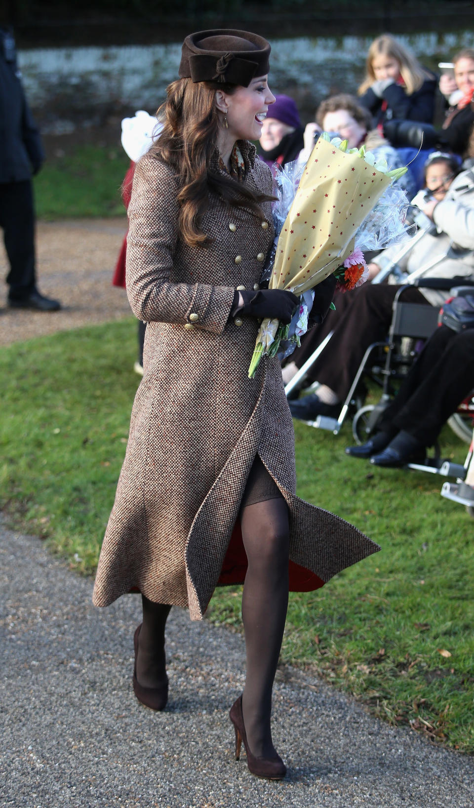 <p>Kate was pregnant with her second child Charlotte at the Christmas Day service in 2014. She wore Moloh’s wool ‘Turpin’ coat over a brown animal print dress from Hobbs, with a printed Really Wild scarf. A matching Lock & Co hat and her suede Emmy ‘Valerie’ courts completed the look. (Getty) </p>