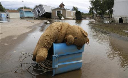 A stuffed teddy bear chair lies slumped over in the flooded Eastwood Village in Evans, Colorado September 23, 2013. REUTERS/Rick Wilking