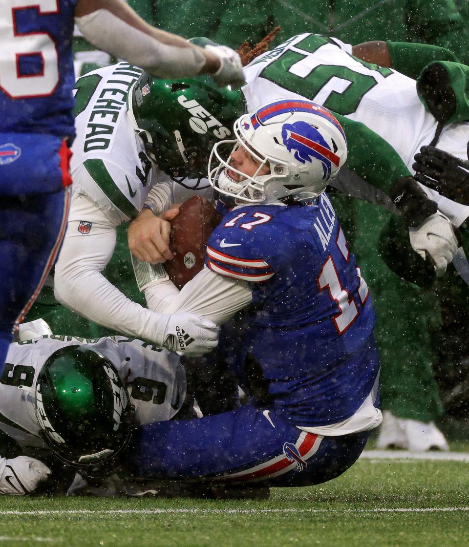 Bills quarterback Josh Allen his hit hard after a first down run against the Jets. 