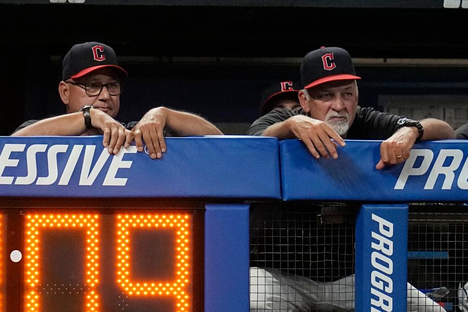 Guardians manager Terry Francona, left, and pitching coach Carl Willis, right, watch from the dugout against the Minnesota Twins on Sept. 4, 2023, in Cleveland.