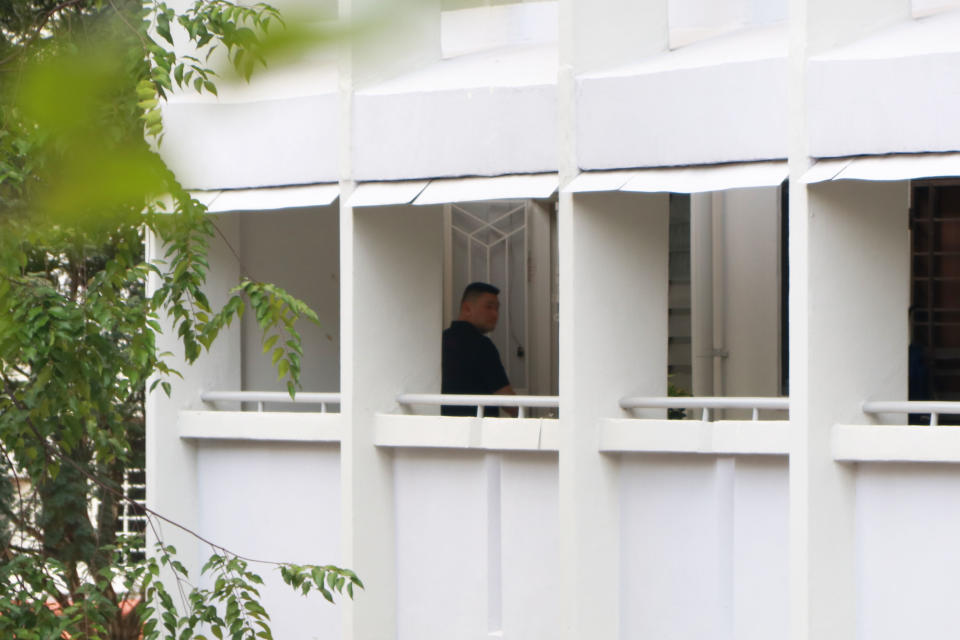 A man seen entering the Hougang flat on 5 October. (PHOTO: Dhany Osman / Yahoo News Singapore)