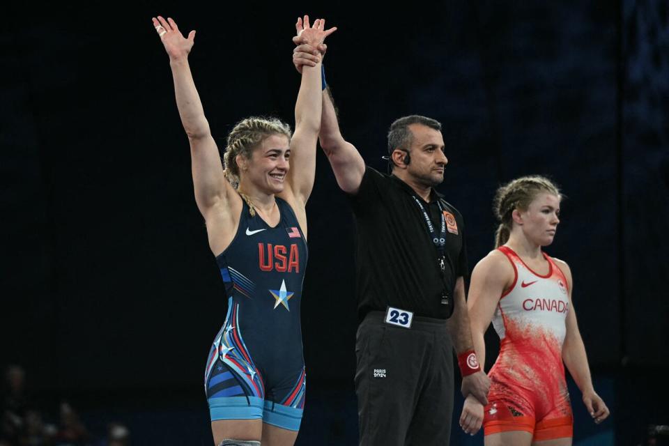 Helen Maroulis of the U.S. is announced as the winner after beating Canada's Hannah Taylor in their women's freestyle -57kg wrestling bronze medal match on Friday. (Punit Paranjpe/AFP via Getty Images - image credit)