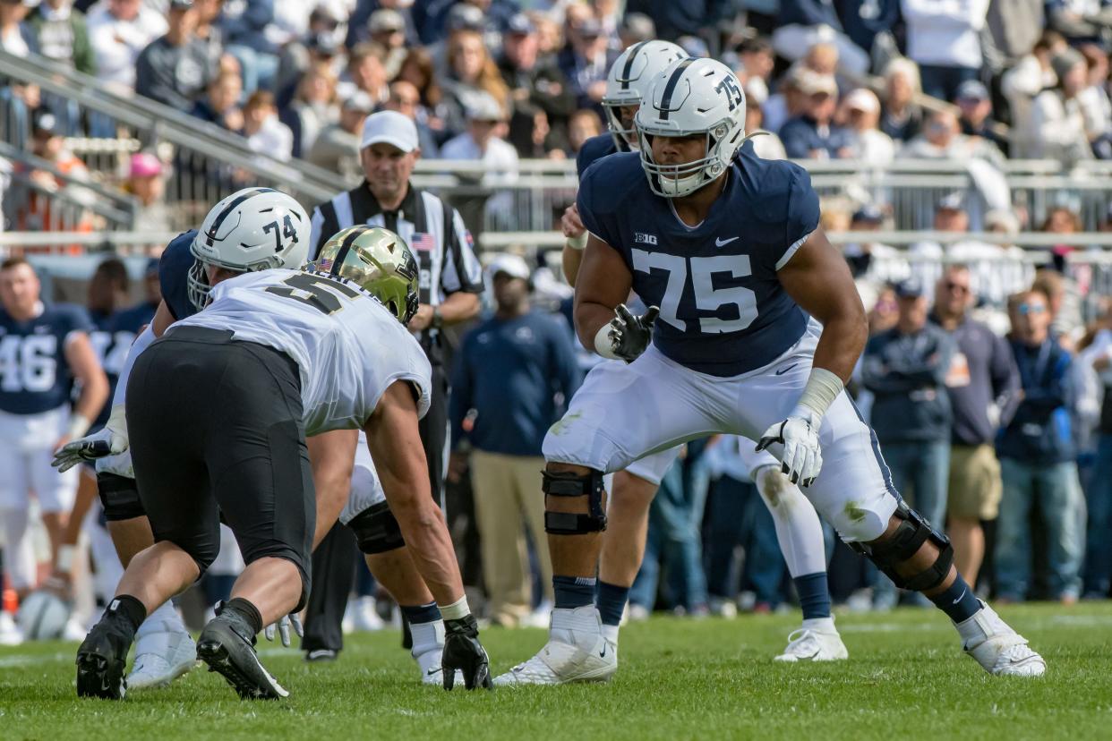 Oct 5, 2019; University Park, PA, USA; Penn State Nittany Lions offensive lineman Des Holmes (75) pass protects against Purdue Boilermakers defensive end George Karlaftis (5) during the first half at Beaver Stadium.