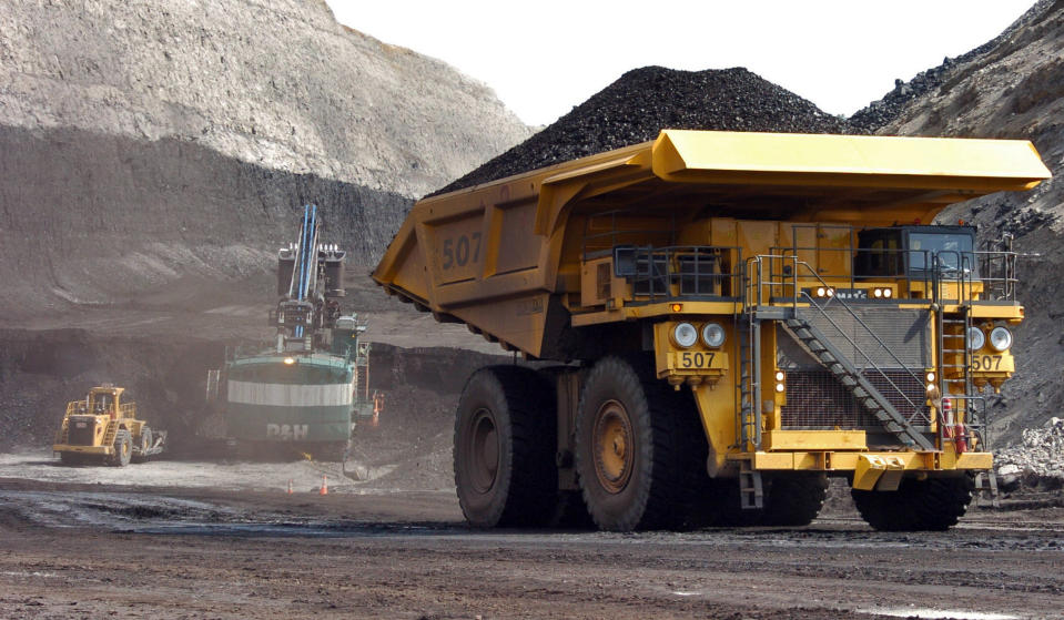 FILE - In this April 4, 2013 file photo, a truck carrying 250 tons of coal hauls the fuel to the surface of the Cloud Peak Energy's Spring Creek mine near Decker, Mont. Coal industry representatives say lawsuits against mines in the West could have consequences across the U.S. as environmentalists seek changes in how mining is approved on federally-owned reserves. In civil cases unfolding in Colorado, New Mexico and Montana, the group WildEarth Guardians asserts coal companies benefited from lax oversight by federal regulators.(AP Photo/Matthew Brown, File)